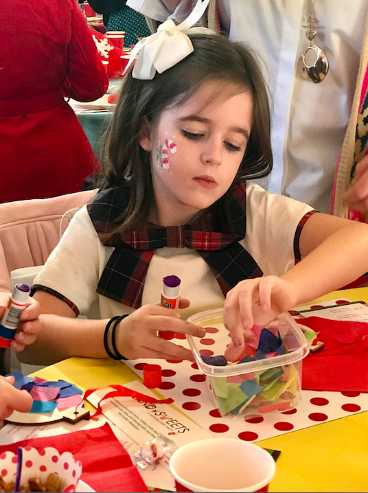 Child working on a craft.