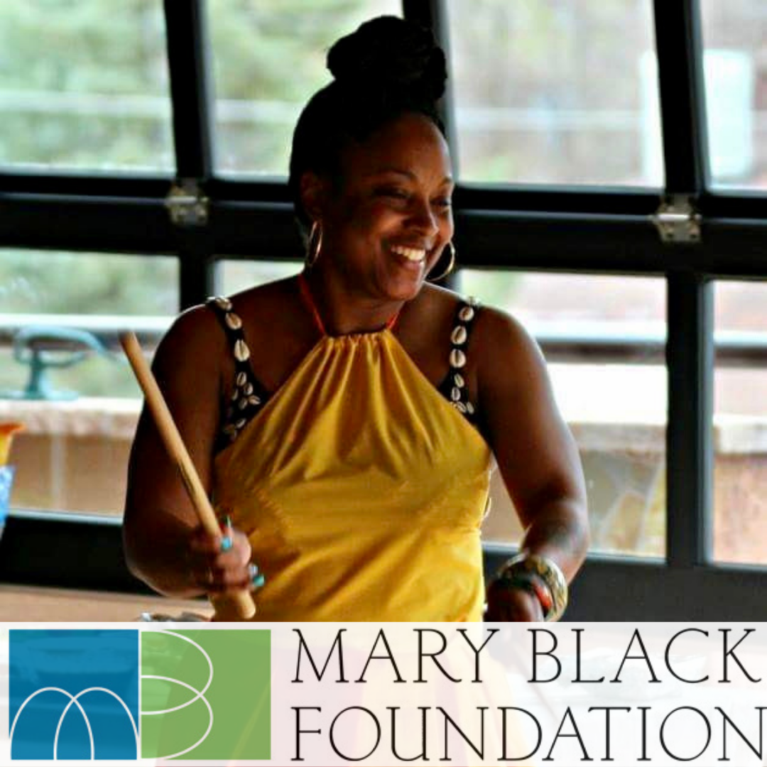 African American Woman Playing the Drums. 